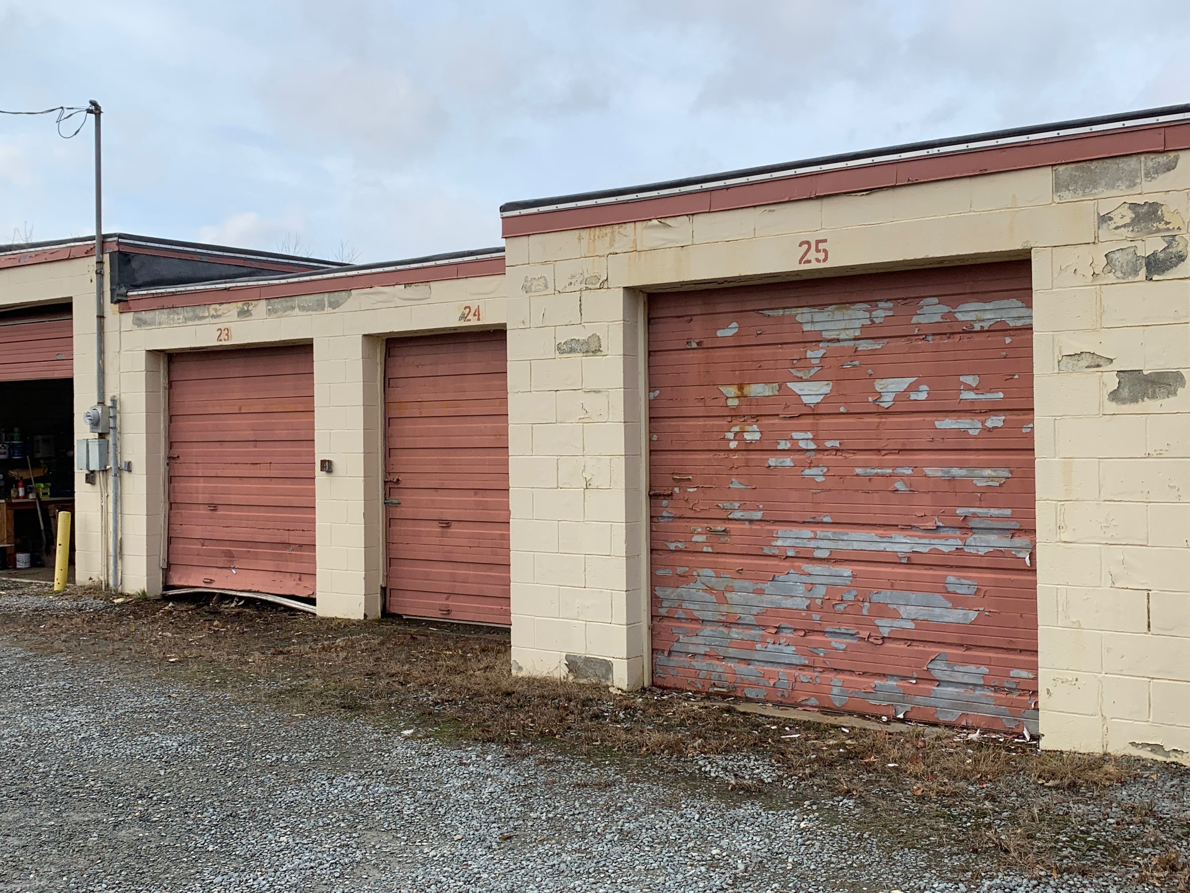 Outdated Self-Storage Doors in Need of Replacement