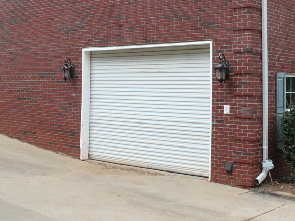 white roll up door model 1000 on garage