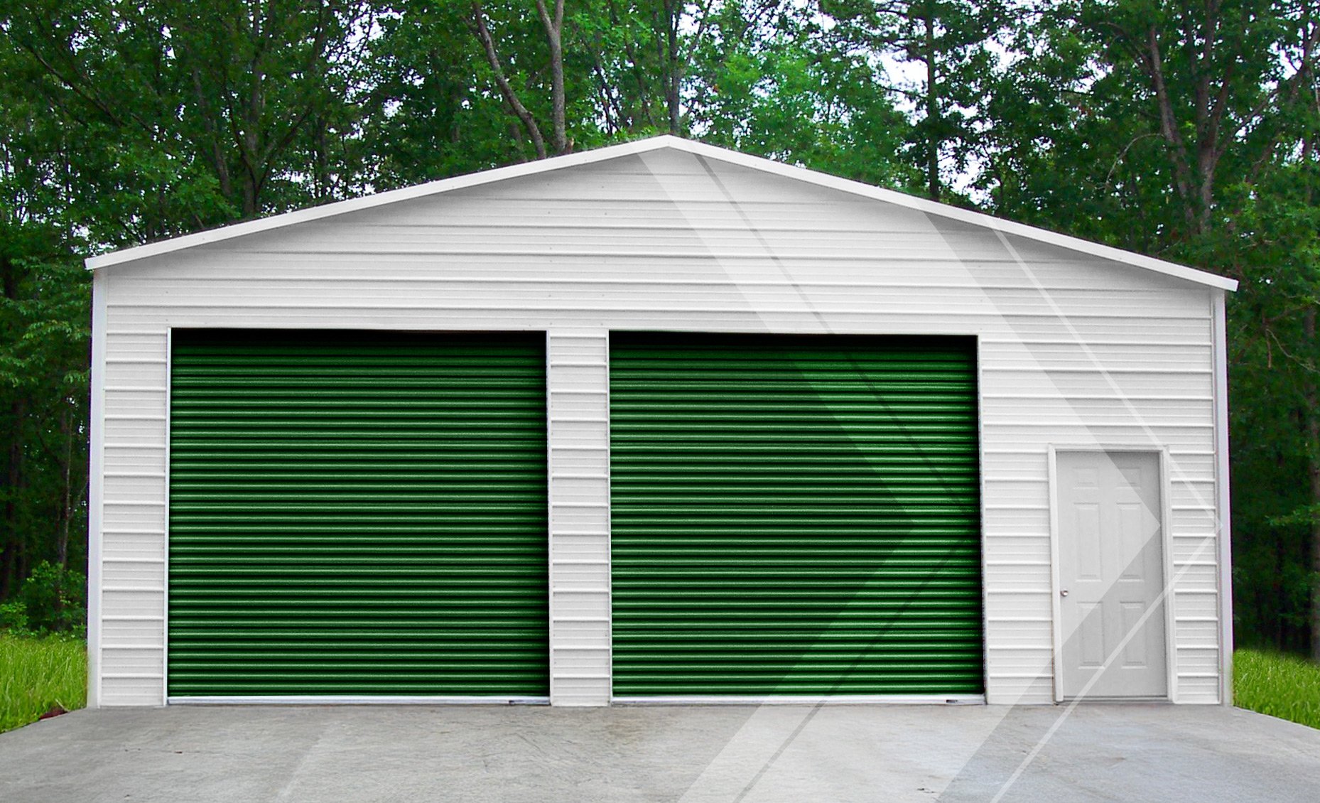 Janus Model 1000 green commercial roll-up doors on a white steel building