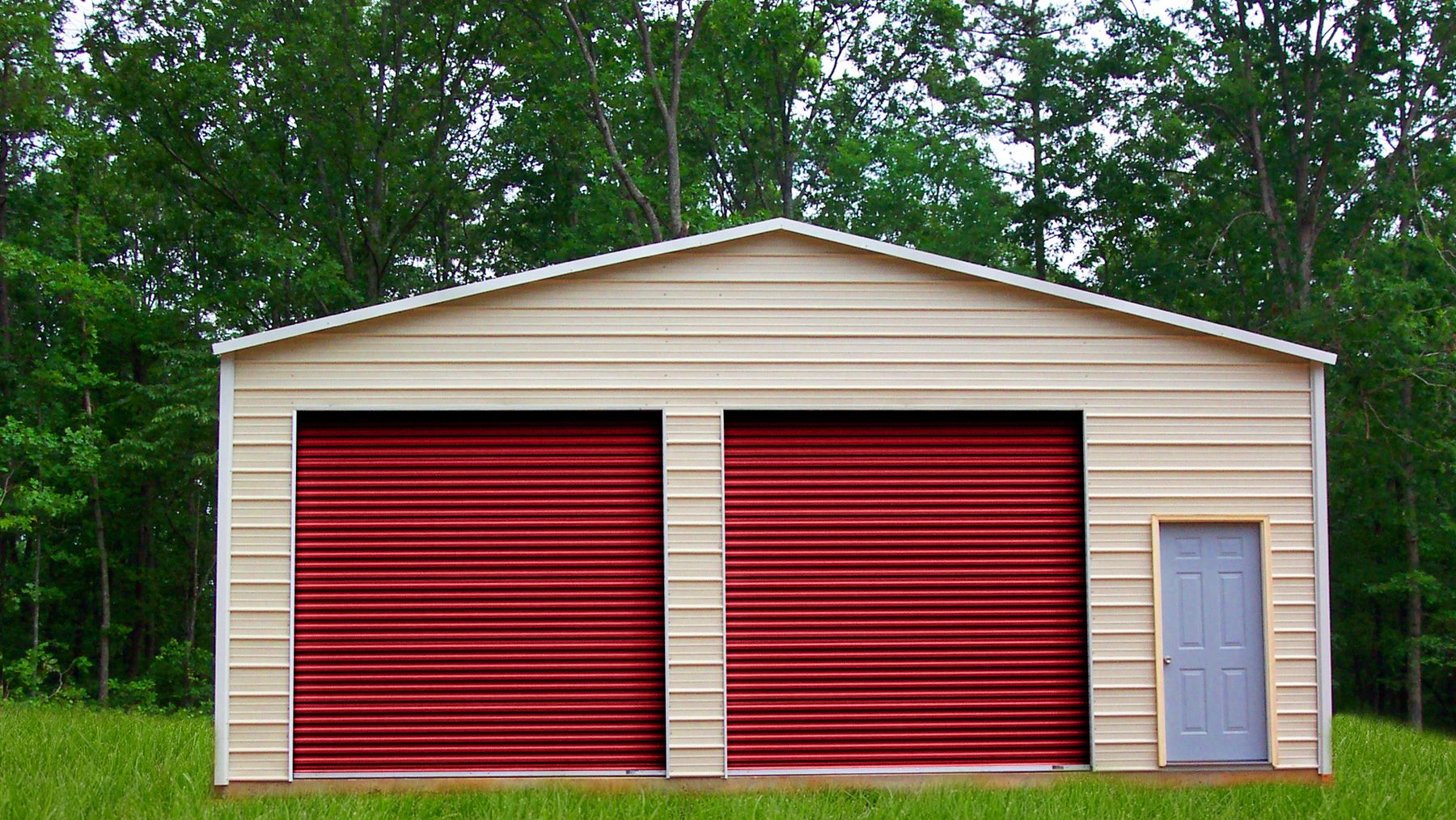 Red Janus 1000 Series doors on a steel building