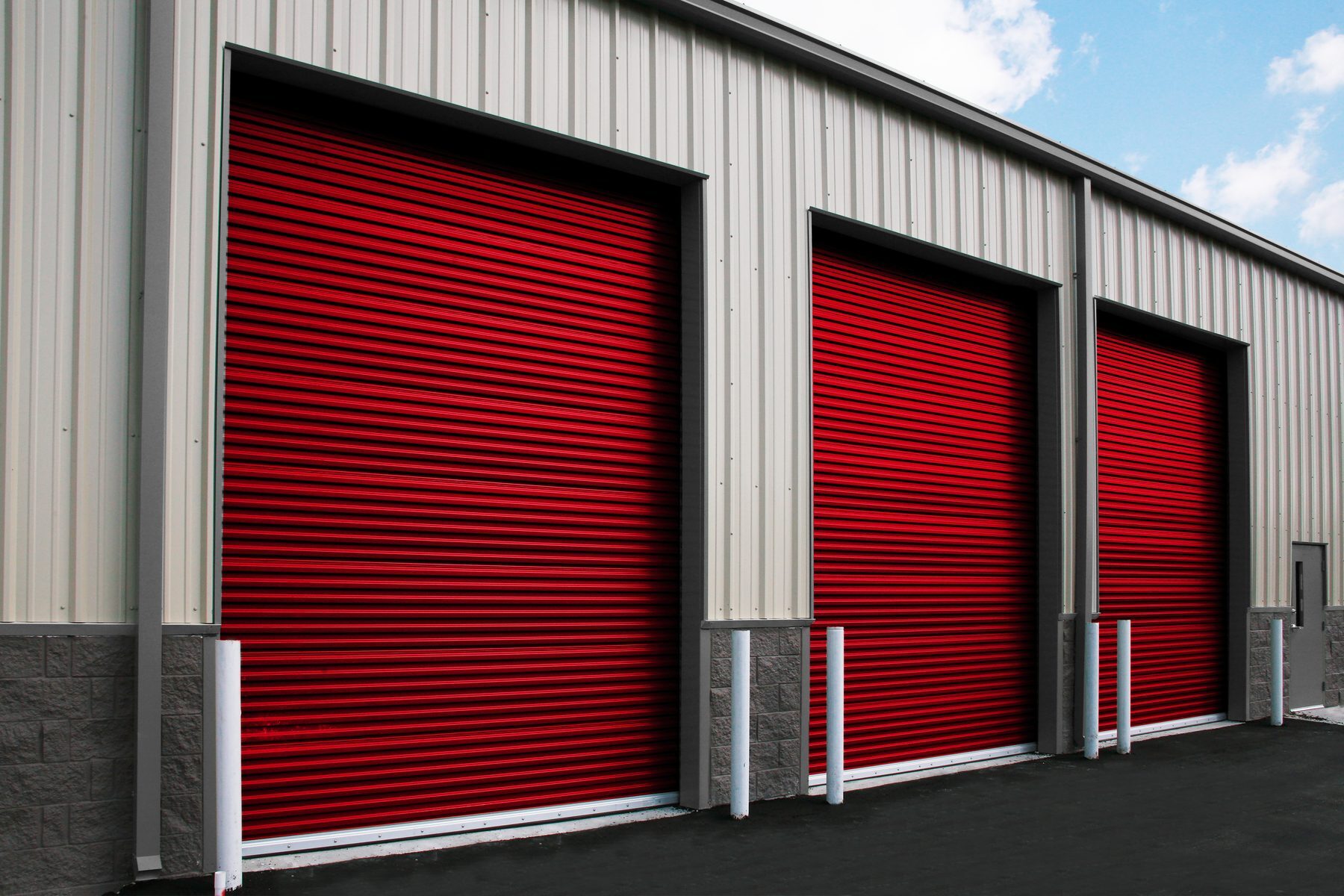 Patriot Red Janus commercial sheet doors on a warehouse