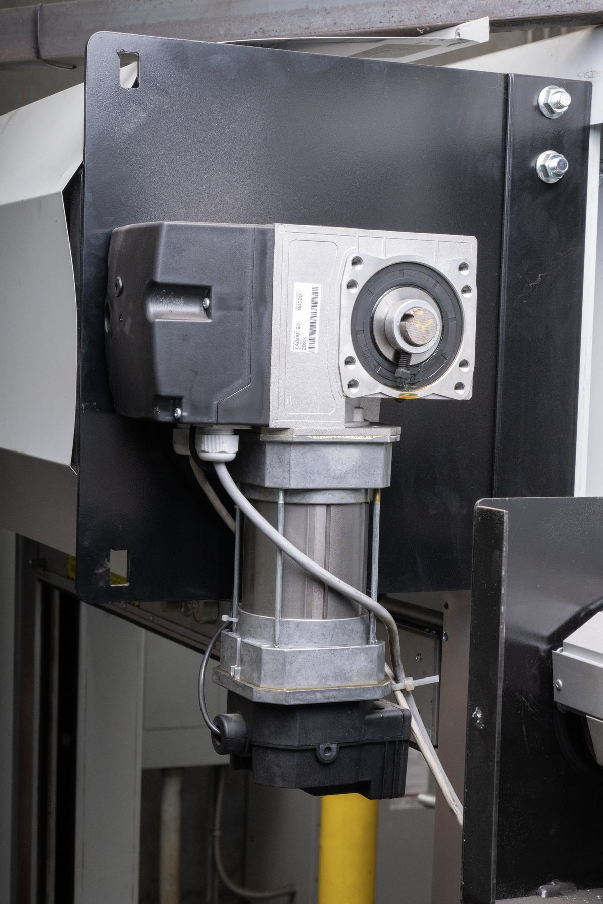 Operator mounted on the bracket of a rolling grille