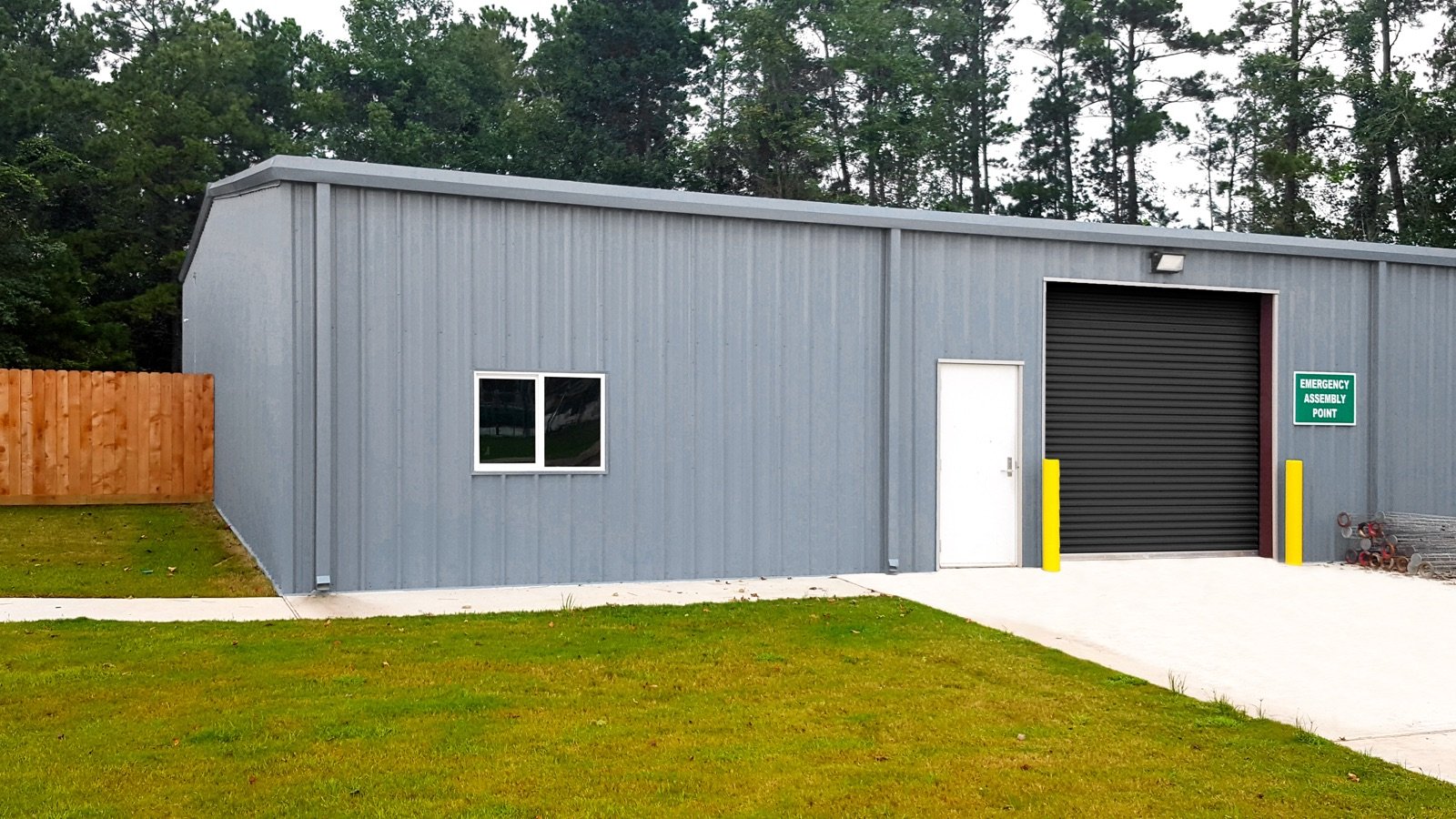 Row of black Janus Model 2000 commercial roll-up doors