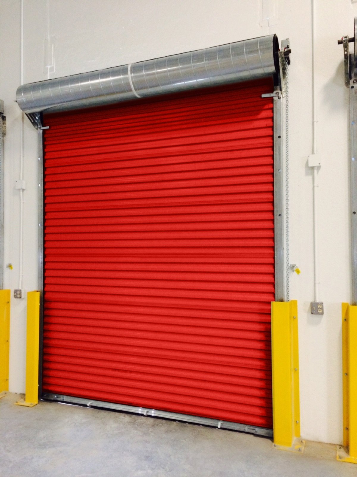 Red Janus Model 2500 commercial roll-up door