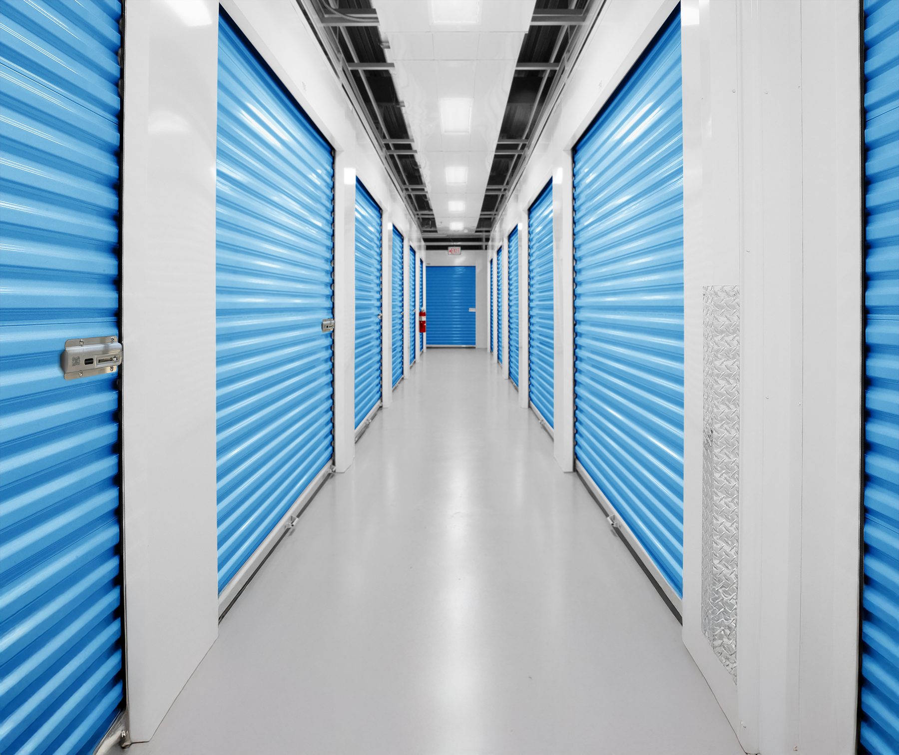 Long self-storage hallway of Smart Blue Janus doors, each with a Nokē Infinitē smart lock