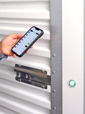 Tenant opening a Nokē Ion smart lock with the Nokē app on a smartphone