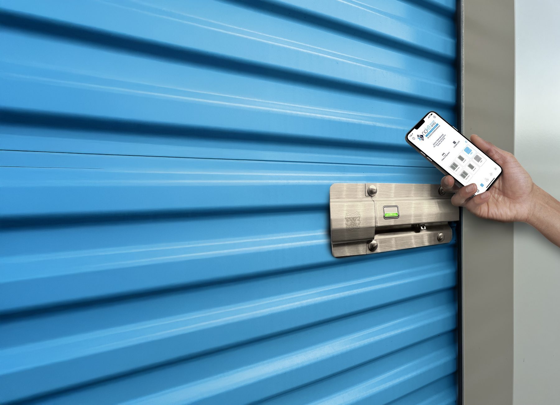 Tenant unlocking a Nokē Infinitē smart lock on a Smart Blue Janus roll-up door with the Nokē app