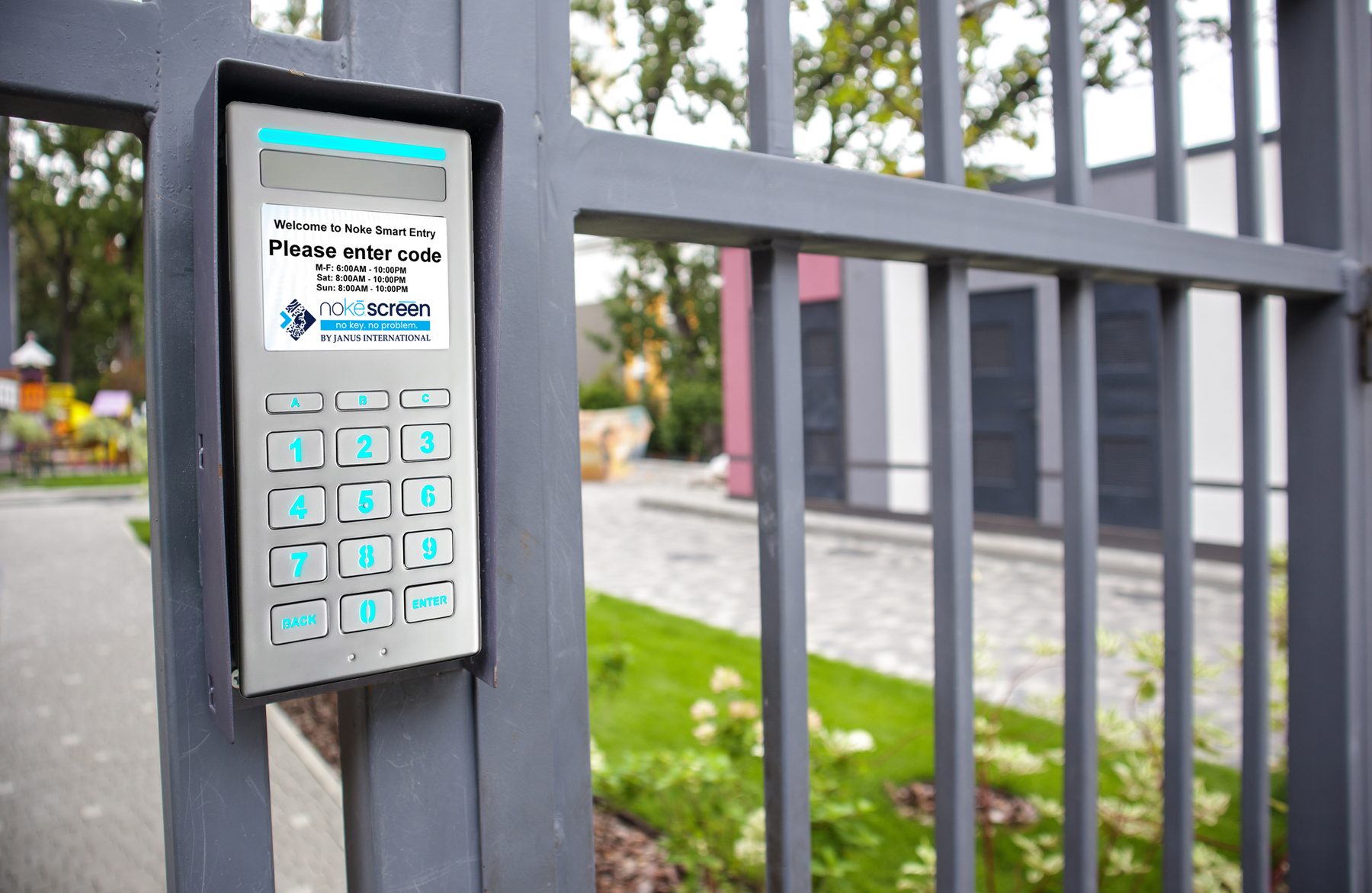 Nokē Screen smart keypad with a full-color display mounted at a self-storage facility gate