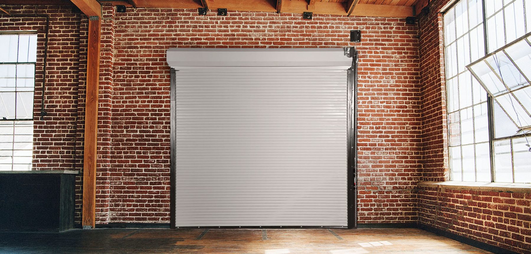 White Janus 500 Series rolling fire door in a brick building