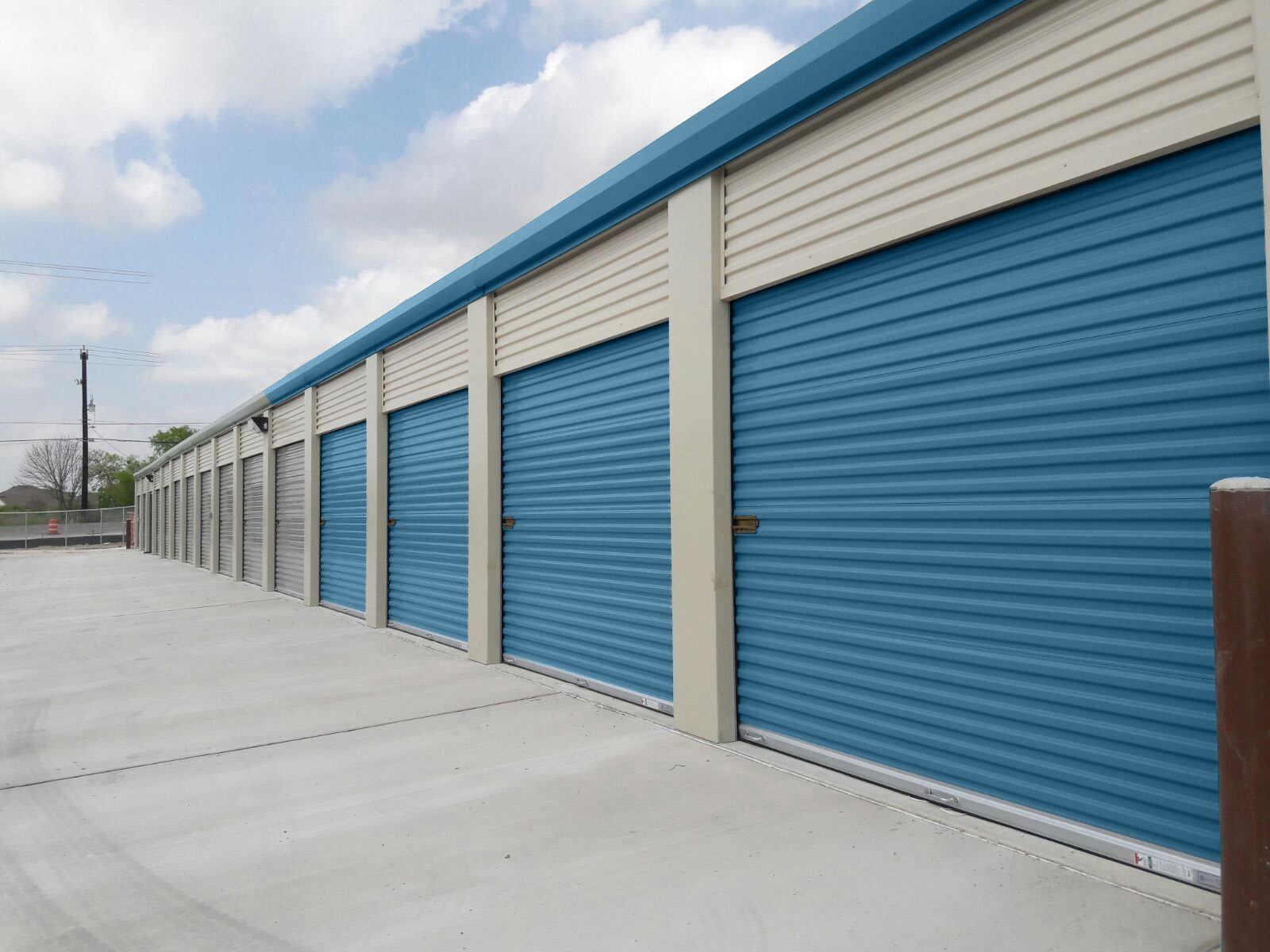 Exterior drive-up building with Polar Blue Janus 750 Series doors