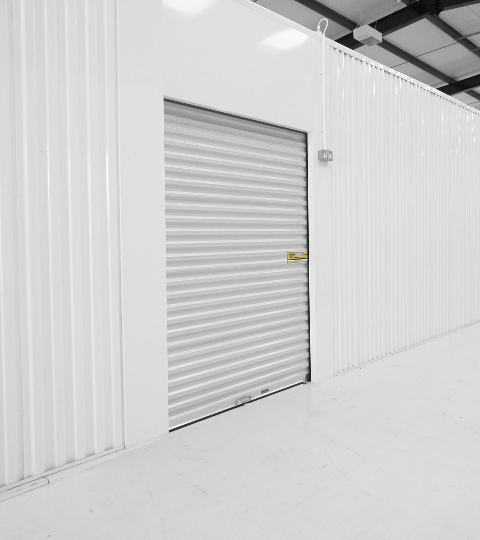 White Janus 850 Series roll-up door in an interior hallway