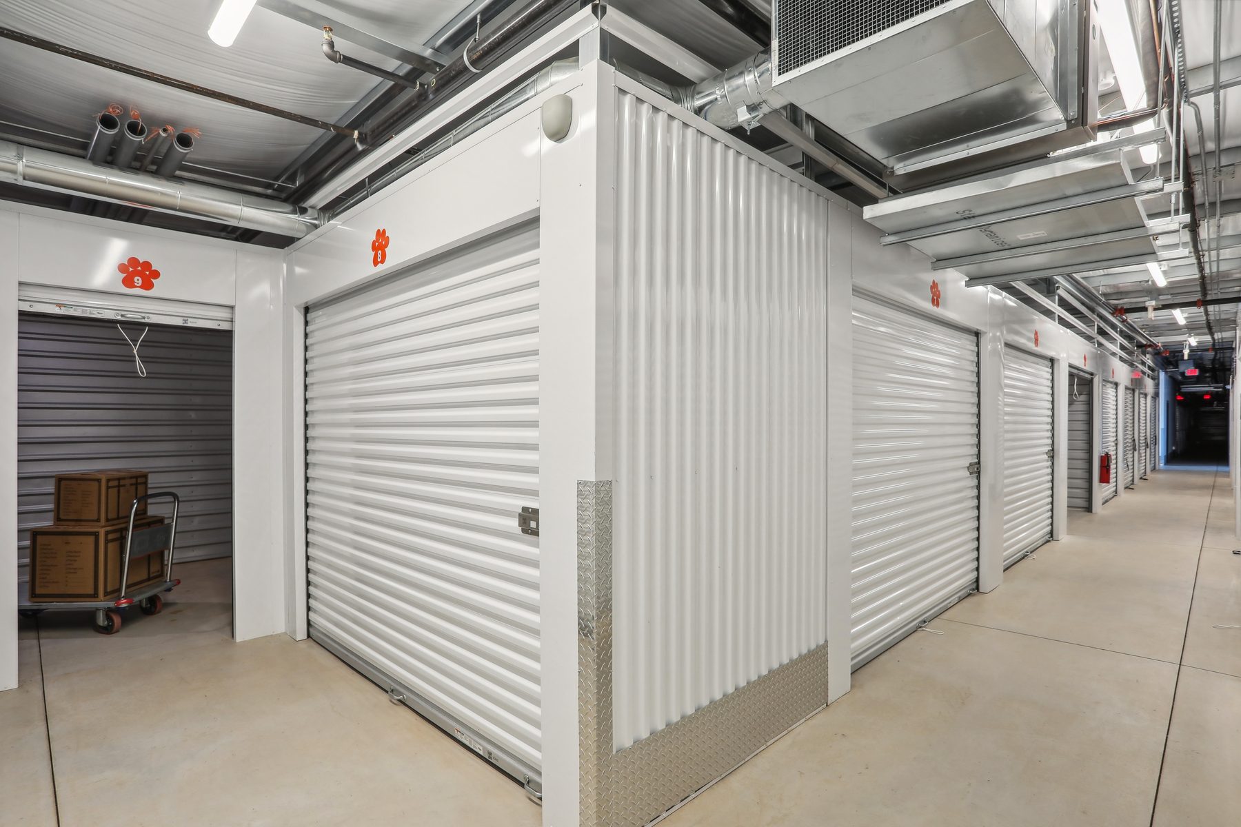 White Janus hallway system with roll-up doors and diamond plate corner guards
