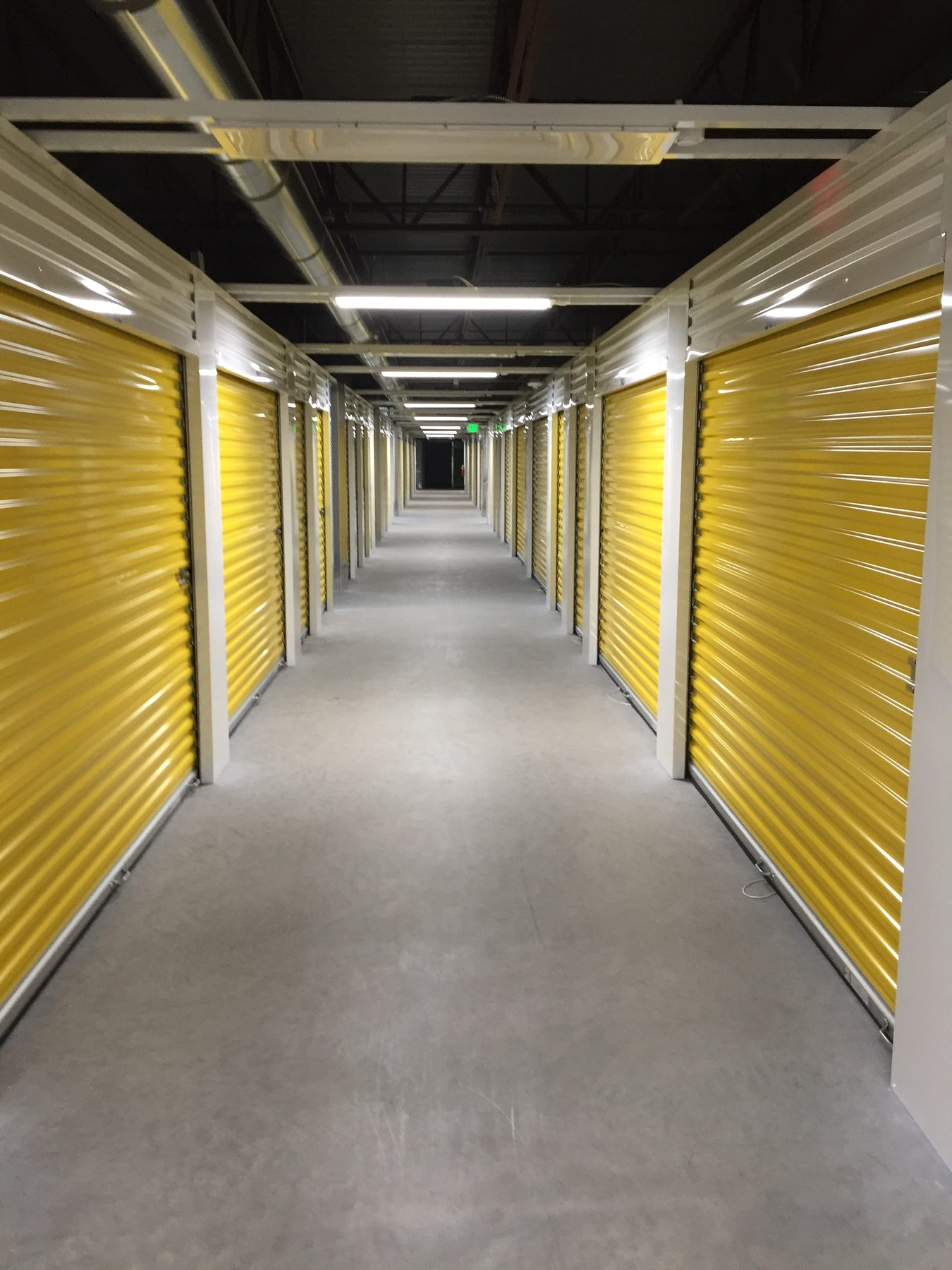 Yellow Janus roll-up doors in a hallway