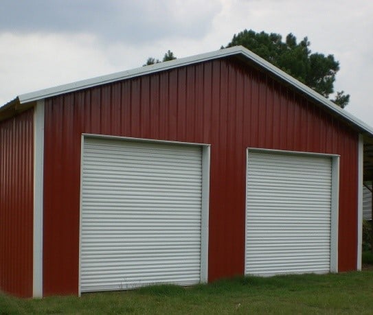 red bard with white commercial steel roll up doors