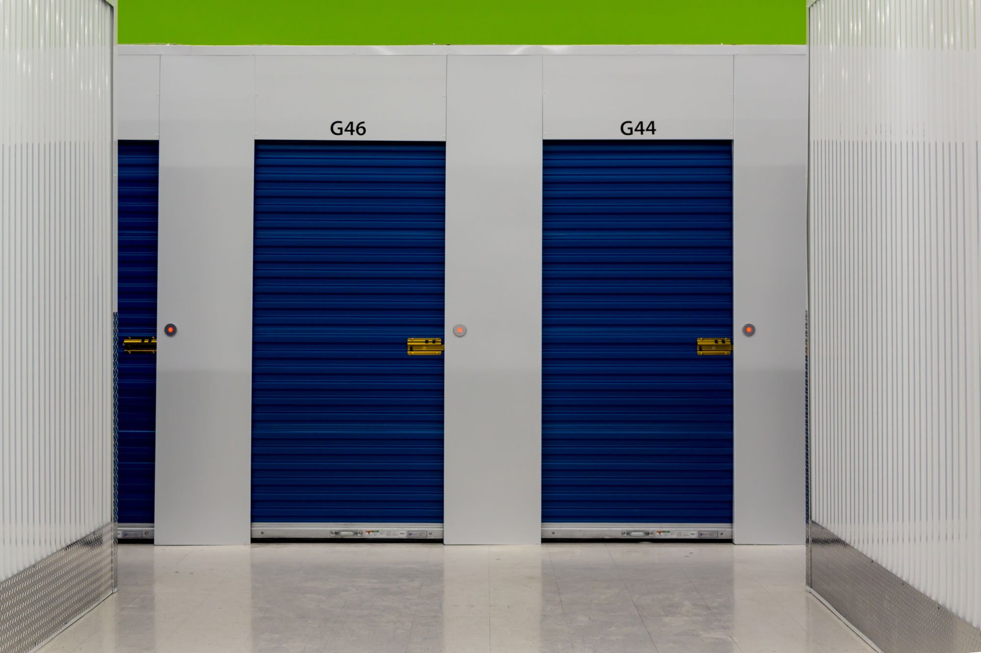 Hallway with swinging self-storage doors equipped with Noke Smart Entry locks 